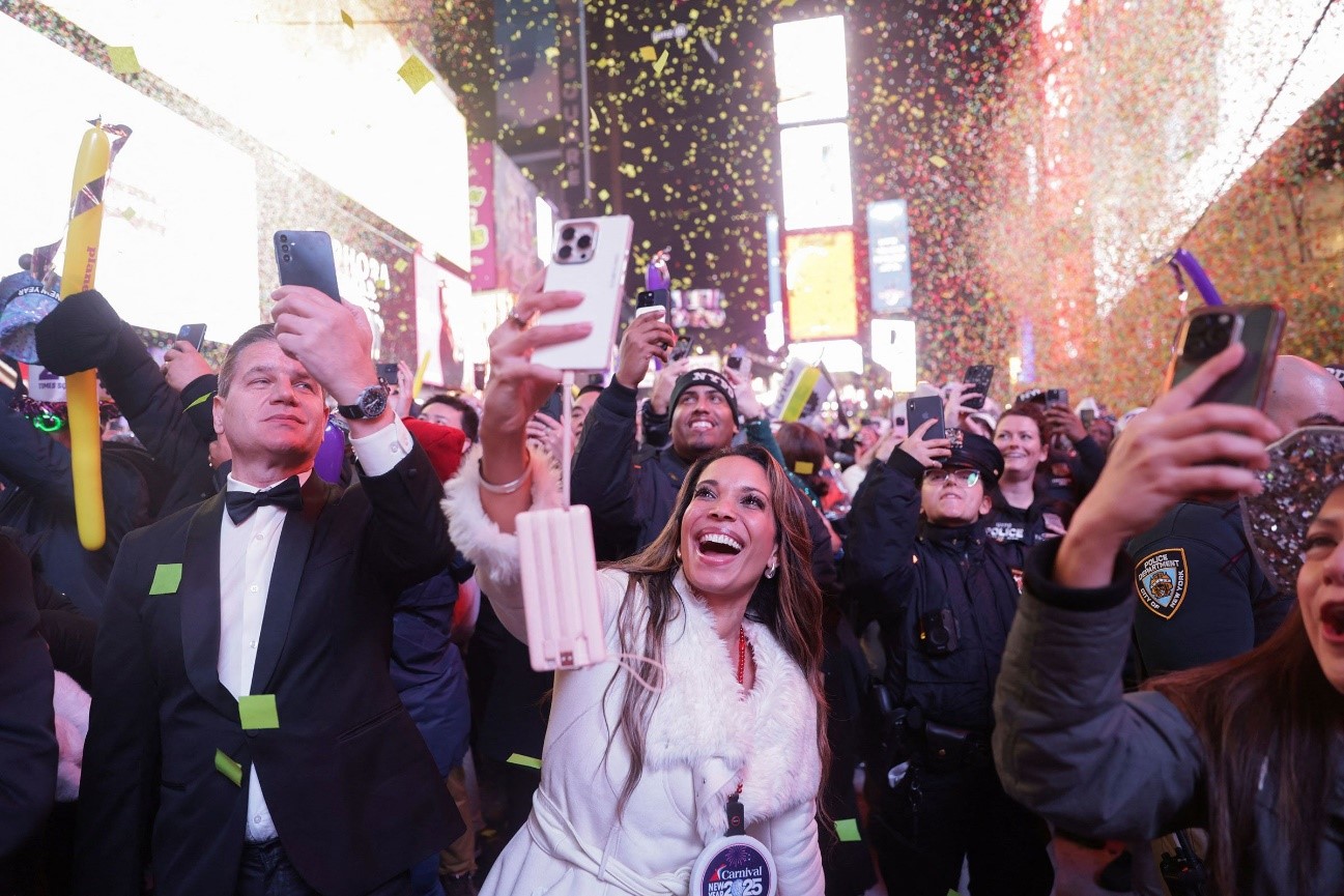 Confetti falls onto the crowd in Times Square. Jeenah Moon/Reuters