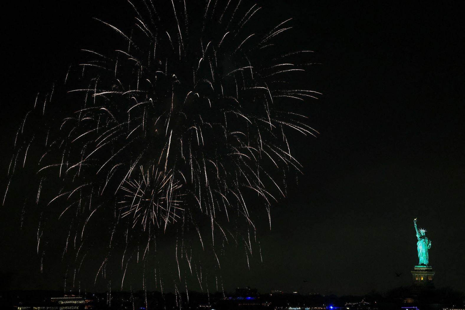 Fireworks explode in the sky above the Statue of Liberty. Charly Triballeau/AFP/Getty Images