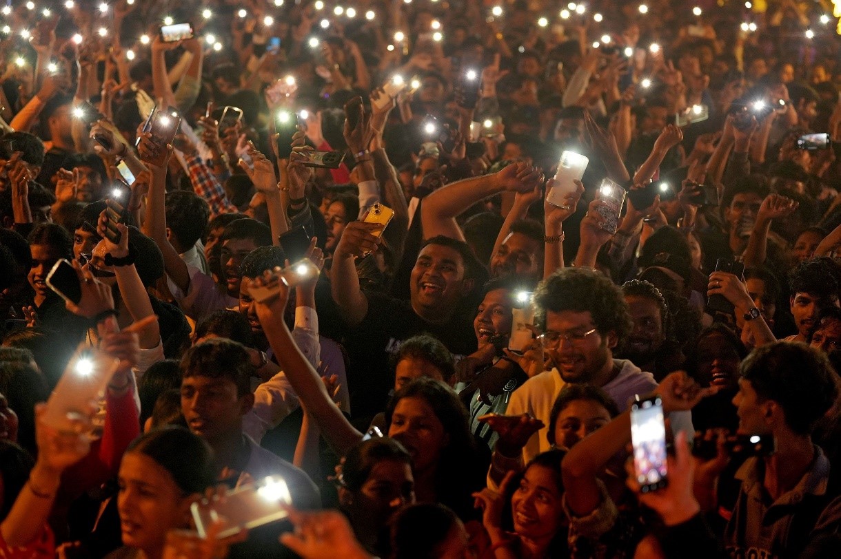 People flash lights from their cell phones as they attend New Year’s celebrations in Mumbai. Hemanshi Kamani/Reuters